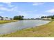 Scenic community pond, surrounded by lush greenery, offering a tranquil view at 511 Ocean Mist Way, Summerville, SC 29486