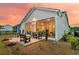 Rear exterior view highlighting the screened porch and outdoor living space at 511 Ocean Mist Way, Summerville, SC 29486