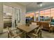 Inviting screened porch with a dining area and comfortable seating, ideal for relaxing at 511 Ocean Mist Way, Summerville, SC 29486