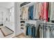 Well-organized walk-in closet leads to an elegant bathroom with double vanity at 511 Ocean Mist Way, Summerville, SC 29486
