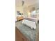 Inviting bedroom with a queen bed, hardwood floors, and elegant wall decor at 519 Parkdale Dr # J, Charleston, SC 29414