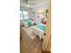 Bright bedroom featuring two twin beds, complemented by modern decor and natural light at 519 Parkdale Dr # J, Charleston, SC 29414