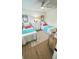 Charming bedroom with two twin beds, stylish decor, and a ceiling fan for comfort at 519 Parkdale Dr # J, Charleston, SC 29414