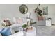 Bright living room featuring a white couch, stylish decor, and ample natural light at 519 Parkdale Dr # J, Charleston, SC 29414