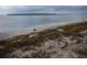 Stunning beach vista with blue ocean, tranquil waves, beachgoers, and distant lush coastal forest at 554 Double Eagle Trce, Seabrook Island, SC 29455