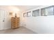 Bright bedroom showcases natural light through its windows, complemented by a wooden dresser for storage at 554 Double Eagle Trce, Seabrook Island, SC 29455