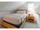 Cozy bedroom features a wood frame bed, a window letting in natural light, and a wooden nightstand at 554 Double Eagle Trce, Seabrook Island, SC 29455