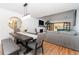 Dining room with modern chandelier, table with seating, and view into living room at 554 Double Eagle Trce, Seabrook Island, SC 29455