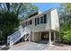 Inviting stilt home with traditional architecture, well-kept yard, and convenient under-house parking space at 554 Double Eagle Trce, Seabrook Island, SC 29455
