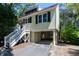 Stately stilt home with classic architectural details, a well-manicured lawn, and convenient under-house parking at 554 Double Eagle Trce, Seabrook Island, SC 29455