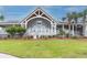 Attractive beach shoppe exterior with a peaked roof, manicured lawn, and inviting entrance at 554 Double Eagle Trce, Seabrook Island, SC 29455