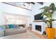 Bright living room featuring an open dining area, fireplace, and hardwood flooring at 554 Double Eagle Trce, Seabrook Island, SC 29455