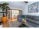Comfortable living room with a large sectional, hardwood floors, and glass doors to a sunroom at 554 Double Eagle Trce, Seabrook Island, SC 29455