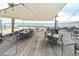 Inviting outdoor dining area with tables, chairs, and picturesque beach views at 554 Double Eagle Trce, Seabrook Island, SC 29455