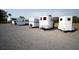 Several white utility trailers are parked on a large lot covered in gravel at 554 Double Eagle Trce, Seabrook Island, SC 29455