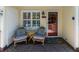 Charming front porch with seating area, including two chairs, small table, and a decorative rug at 554 Double Eagle Trce, Seabrook Island, SC 29455