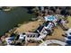 Aerial view showcases luxury amenities, a pool, and lush landscaping near a tranquil lake at 555 Double Eagle, Seabrook Island, SC 29455