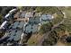 Aerial view of multiple tennis courts nestled among trees; part of a vibrant community at 555 Double Eagle, Seabrook Island, SC 29455