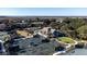 Aerial view of tennis courts and clubhouse nestled among lush trees with distant water views at 555 Double Eagle, Seabrook Island, SC 29455