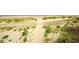 Picturesque beach scene with lush greenery, sand dunes, and a sandy path leading to the ocean at 555 Double Eagle Trce, Seabrook Island, SC 29455
