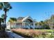 Stately clubhouse with wide porch and manicured landscaping at Seabrook Island at 555 Double Eagle Trce, Seabrook Island, SC 29455