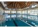 Bright indoor pool area featuring a vaulted ceiling, multiple windows and plenty of natural light at 555 Double Eagle, Seabrook Island, SC 29455