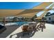 Community zero entry pool featuring sunshades, lounge seating, tropical trees, and a splash pad at 555 Double Eagle, Seabrook Island, SC 29455