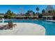 Large community swimming pool with lounge chairs, covered areas, and well-maintained surrounding concrete at 555 Double Eagle, Seabrook Island, SC 29455