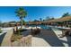 Community pool with lounge seating, covered areas, and tropical landscaping on a beautiful sunny day at 555 Double Eagle, Seabrook Island, SC 29455