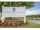 Seabrook Island Club Equestrian Center sign on a sunny day with beautiful landscaping and an equestrian fence in the distance at 555 Double Eagle, Seabrook Island, SC 29455