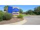 Bohicket Marina & Market sign featuring dining and activities surrounded by trees and vegetation along the roadside at 555 Double Eagle, Seabrook Island, SC 29455