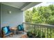 Balcony with blue chairs and lush green scenery at 60 Fenwick Hall Allee # 432, Johns Island, SC 29455
