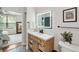 Beautiful bathroom with a wood vanity, matte black hardware, and decorative tile floors at 60 Fenwick Hall Allee # 432, Johns Island, SC 29455