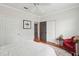 Bedroom featuring a ceiling fan, red chair, and two doors leading to closets and other rooms at 60 Fenwick Hall Allee # 432, Johns Island, SC 29455