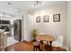 Open concept dining area located next to kitchen featuring wood floors at 60 Fenwick Hall Allee # 432, Johns Island, SC 29455