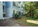 Exterior of a light-blue building with trees and green grass at 60 Fenwick Hall Allee # 432, Johns Island, SC 29455