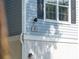 Close-up detail of house number against the gray siding with a black window shutter at 60 Fenwick Hall Allee # 432, Johns Island, SC 29455