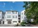 Charming condo building featuring a private garage and inviting entrance on a beautiful sunny day at 60 Fenwick Hall Allee # 432, Johns Island, SC 29455