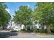 The complex shows mature trees, accessible parking, and lovely landscaping at 60 Fenwick Hall Allee # 432, Johns Island, SC 29455