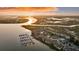 Aerial view of the community along the water featuring a full marina and tennis courts at 63 Mariners Cay, Folly Beach, SC 29439