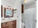 Well-lit bathroom with a classic vanity, modern fixtures, and a shower-tub combination, providing a functional and stylish space at 63 Mariners Cay, Folly Beach, SC 29439