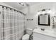 Clean bathroom with a modern vanity, elegant fixtures, and a shower-tub combination, offering a comfortable and functional space at 63 Mariners Cay, Folly Beach, SC 29439