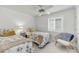 Bright bedroom with twin beds, stylish decor, and natural light, creating a comfortable and inviting space for relaxation at 63 Mariners Cay, Folly Beach, SC 29439