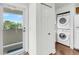 Hallway with closet washer/dryer, and view to the outside at 63 Mariners Cay, Folly Beach, SC 29439