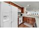 Bright kitchen showcasing stainless steel appliances, white cabinets, and a breakfast bar at 63 Mariners Cay, Folly Beach, SC 29439