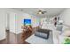 Open-concept living room showcasing a television, comfortable seating, and seamless flow into the kitchen area, ideal for entertaining at 63 Mariners Cay, Folly Beach, SC 29439