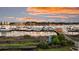 Scenic marina view with boats docked along the pier and beautiful sky at sunset at 63 Mariners Cay, Folly Beach, SC 29439