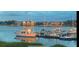 Scenic waterfront view with boats docked near charming waterfront homes, perfect for nautical enthusiasts at 63 Mariners Cay, Folly Beach, SC 29439