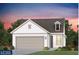 Charming one-story home with a two-car garage and a dormer window amidst lush landscaping at 717 Blue Iris Way, Summerville, SC 29486