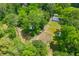 Aerial shot of property featuring trees, a large yard, and an outbuilding at 7239 Commodore Rd, Hollywood, SC 29449